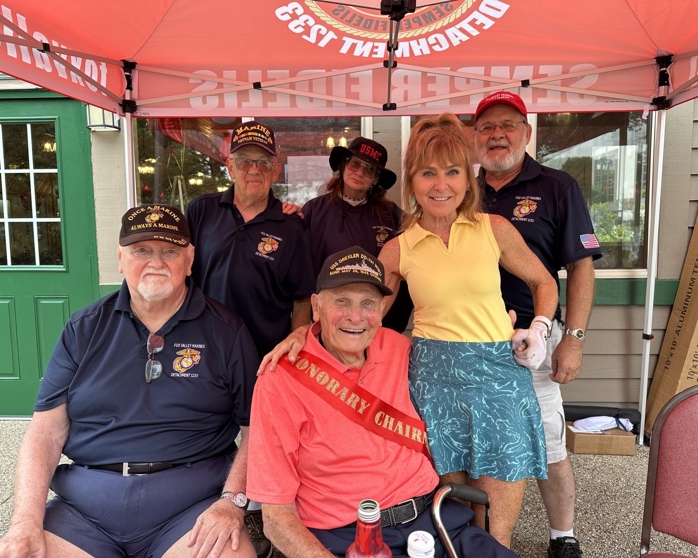 Patty Smith with members of the Fox Valley Marines, Detachment 1233, under their tent